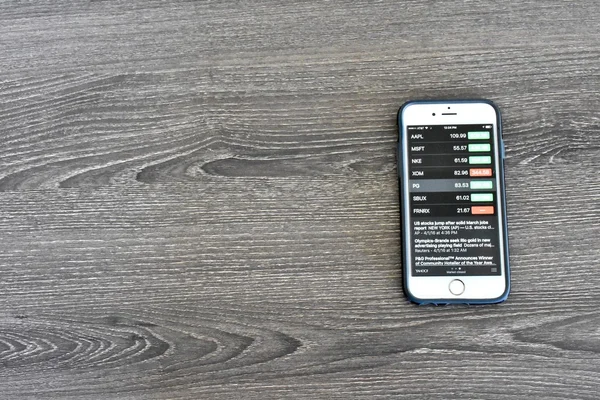 Apple iPhone 6s displaying stock market information