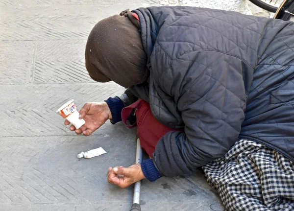 Homeless woman begging for money