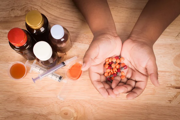 Little boy hold medicine in hand vintage