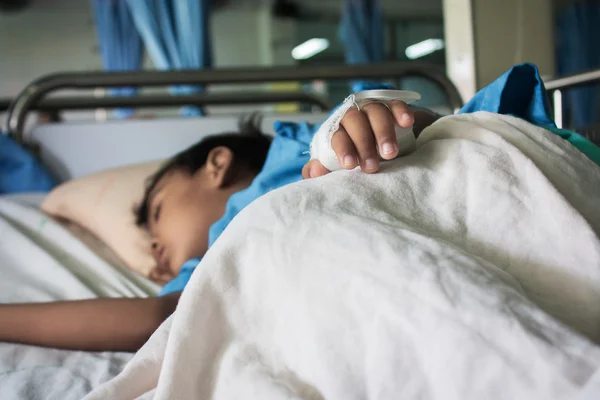 Hand of The Patient on the bed,little boy sick in the Hospital