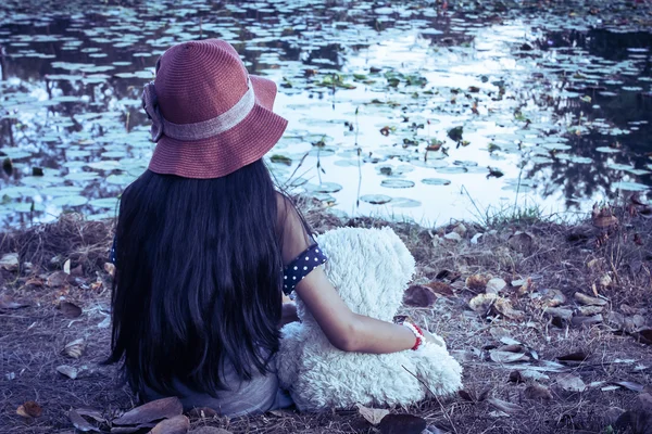 Vintage tone,asian girl sad sitting alone in the park