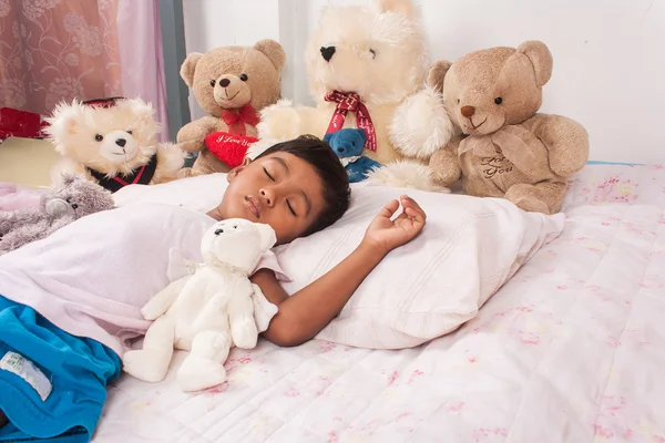 Little asian boy sleep with teddy bear