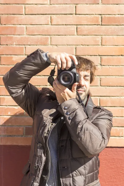 Close-up of young handsome photographer