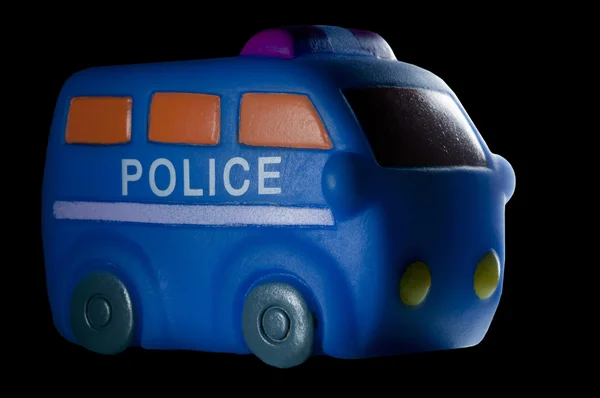 Police vehicle toy isolated on black