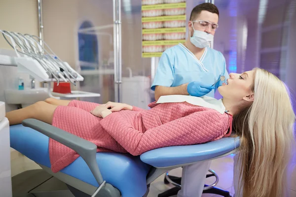 Treatment of the patient girl in the dental clinic