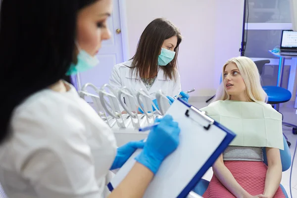 Treatment of the patient girl in the dental clinic