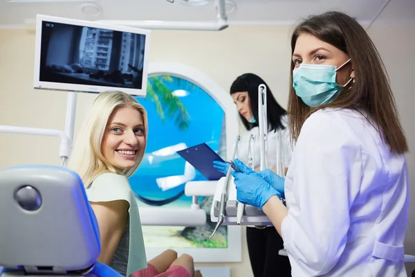 Treatment of the patient girl in the dental clinic