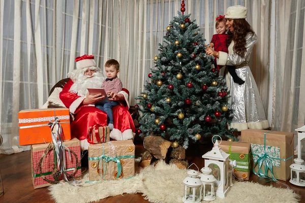 Santa Claus gives presents at the celebration Christmas