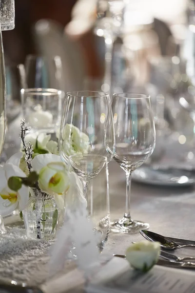 Wedding reception with floral arrangement of white orchids