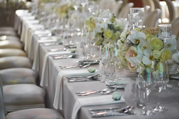 Wedding reception with floral arrangement of white orchids