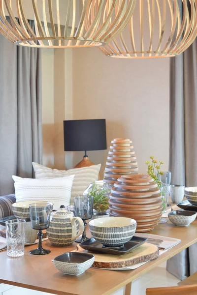 Elegant table set in modern style dining room interior