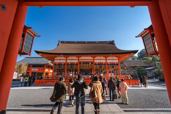 Tourism walking around Main gate of Fushimi Inari-taisha shrine in Kyoto, Japan.