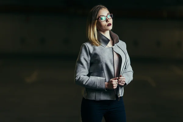 Young woman standing on the parking line