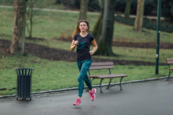 Young sport girl running in the park