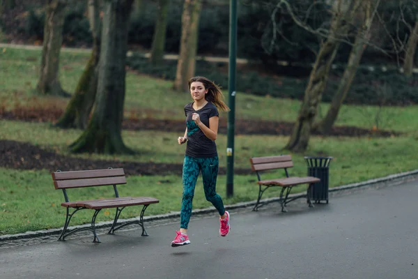 Young sport girl running in the park