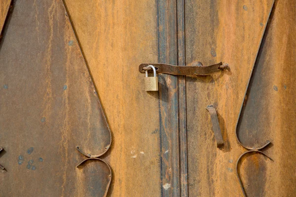Detail of a door and its lock on an old tradional house in Moroc