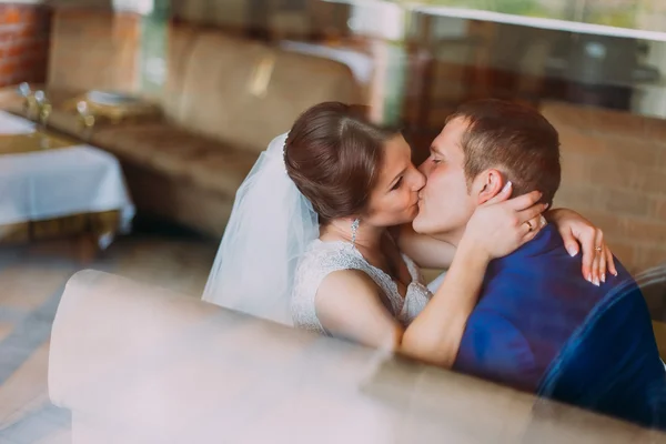 Sensual wedding couple. Beautiful bride and groom kissing. Close-up