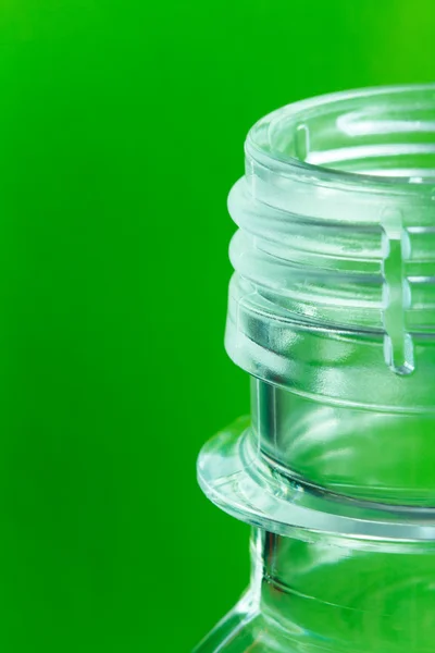 Plastic bottle on a green background