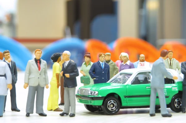 Model taxi and small figures