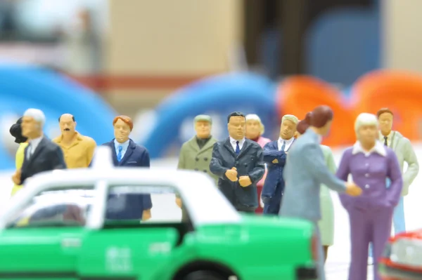 Model taxi and small figures