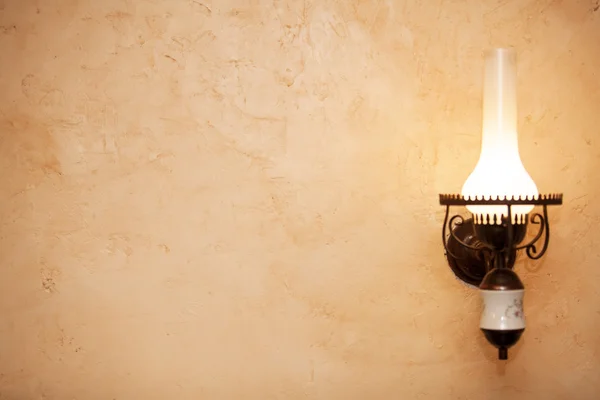 Old lamp on wall