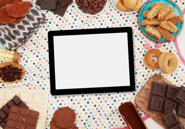 Digital tablet, sweets and ingredients