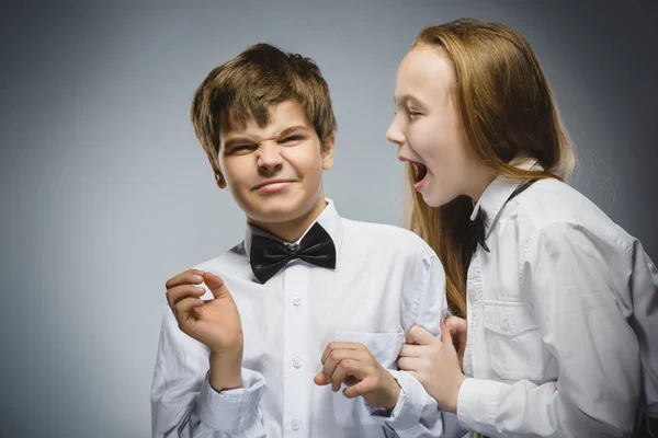 Angry girl shouting at frightened dissatisfied boy. Negative human emotion, facial expression. Closeup. Communication concept