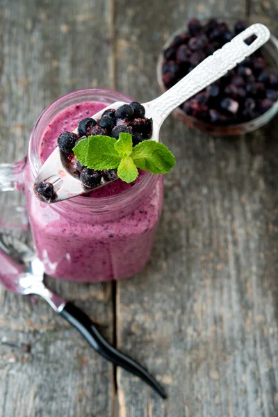 Delicious bilberry smoothie with fresh berries, fresh yogurt with bilberry