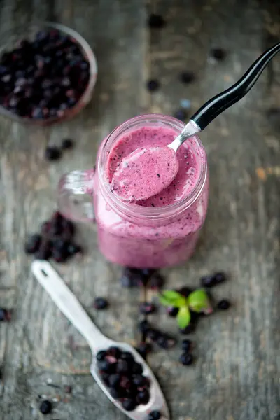 Delicious bilberry smoothie with fresh berries, fresh yogurt with bilberry