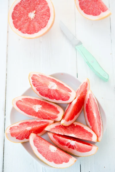 Fresh red grapefruit cut by segments