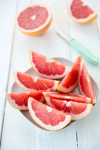 Fresh red grapefruit cut by segments