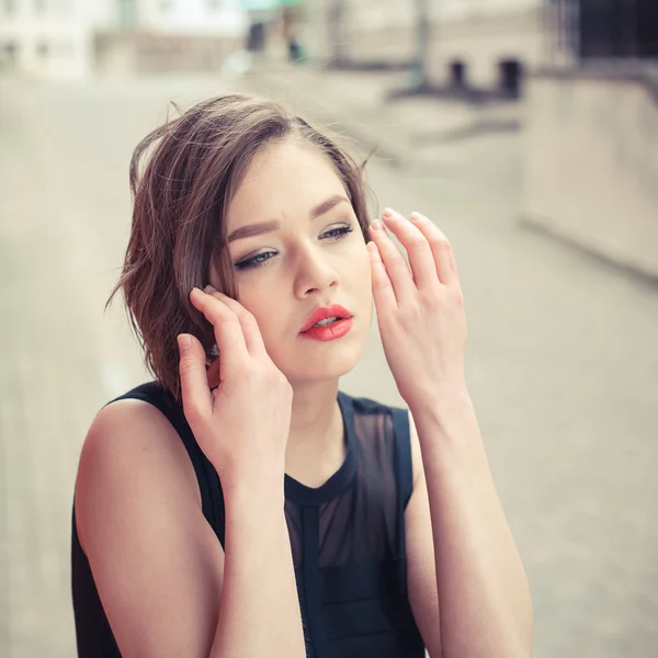 Vogue model in the black dress outdoor portrait