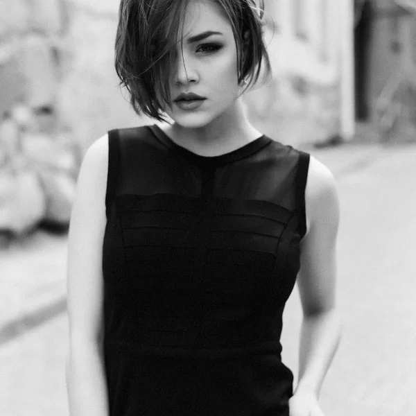 Vogue model in the black dress outdoor portrait