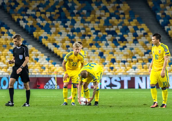 Ukrainian players Konoplyanka, Zinchenko, Rakitskiy preparing for the free kick