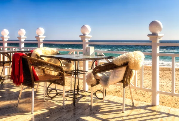 Cafe tables and chairs, skin, sunrise, sea view