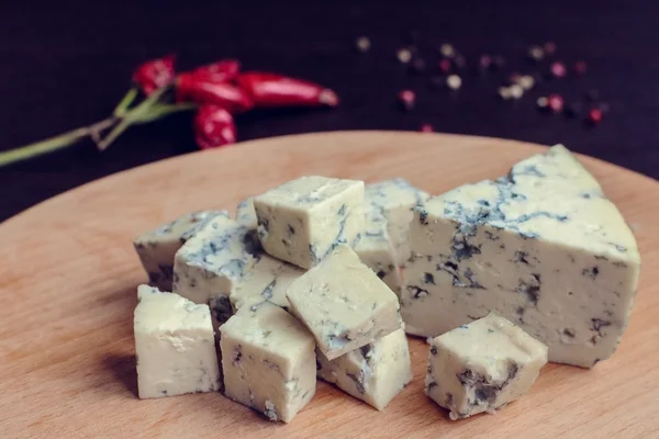 Blue cheese on wooden board