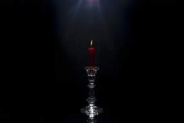 Red candle on black  background