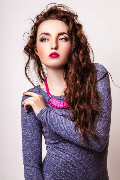 Studio photo of young  woman on white background