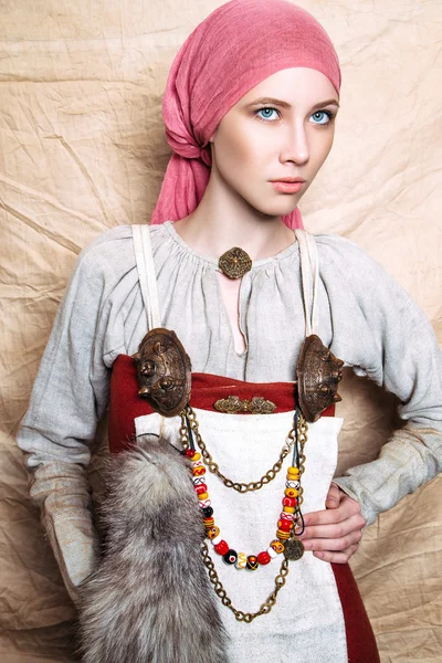 Portrait of slavic women from the past. Historical reconstruction. National vintage clothing. Studio