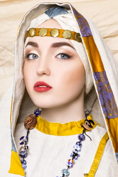 Portrait of slavic women from the past. Historical reconstruction. National vintage clothing. Studio