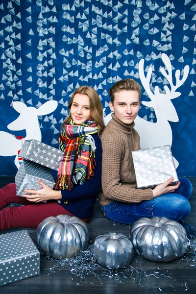Falling in love boy and  girl in blue and white Christmas decora