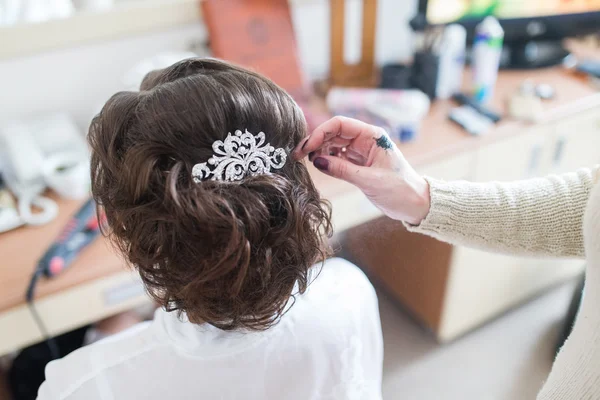 Bride\'s hair, styled with a hair ornament