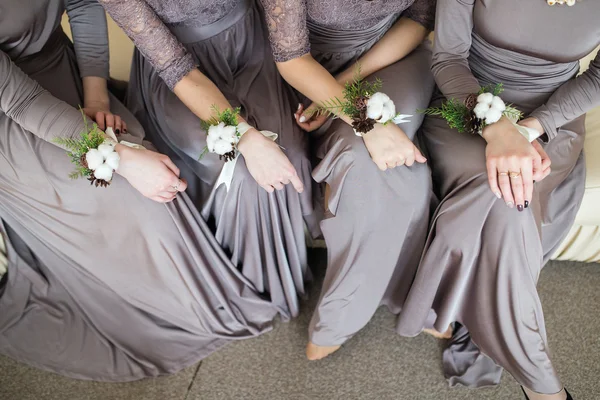 Bridesmaids with wedding bouquet of flowers