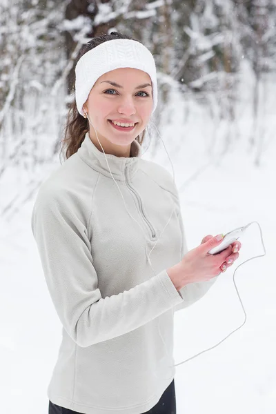 Woman listening to music and jogging