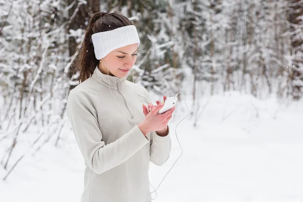 Woman listening to music and jogging