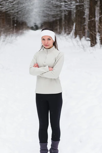 Sport woman running in winter.