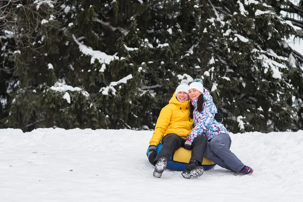 Young happy couple walking in winter park