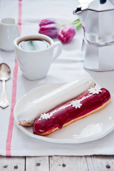 Breakfast with French colorful eclairs