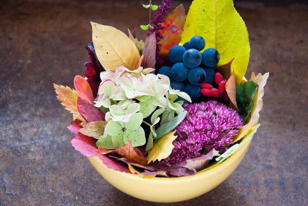 Autumn Bouquet with leaves, flowers and fruits