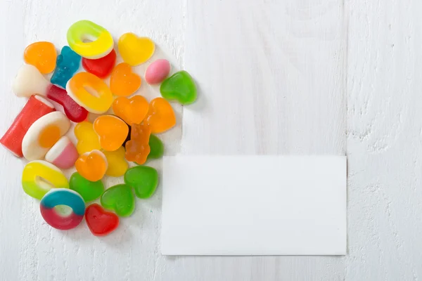 A lot of candies with greeting card.